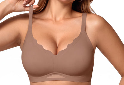 A woman wearing a seamless, unlined bra in a brown color, featuring scalloped edges and adjustable shoulder straps, shown against a solid white background.